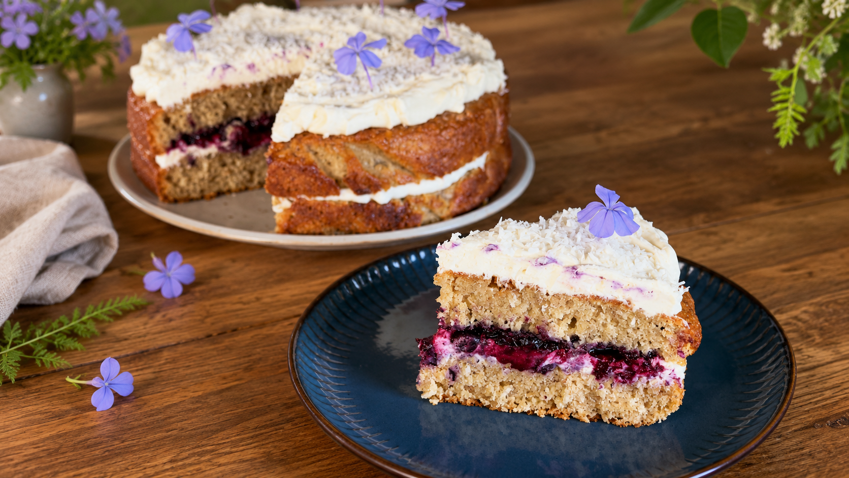 banana bread cake with macadamia oil and blueberry on a wooden table with lilac flowers