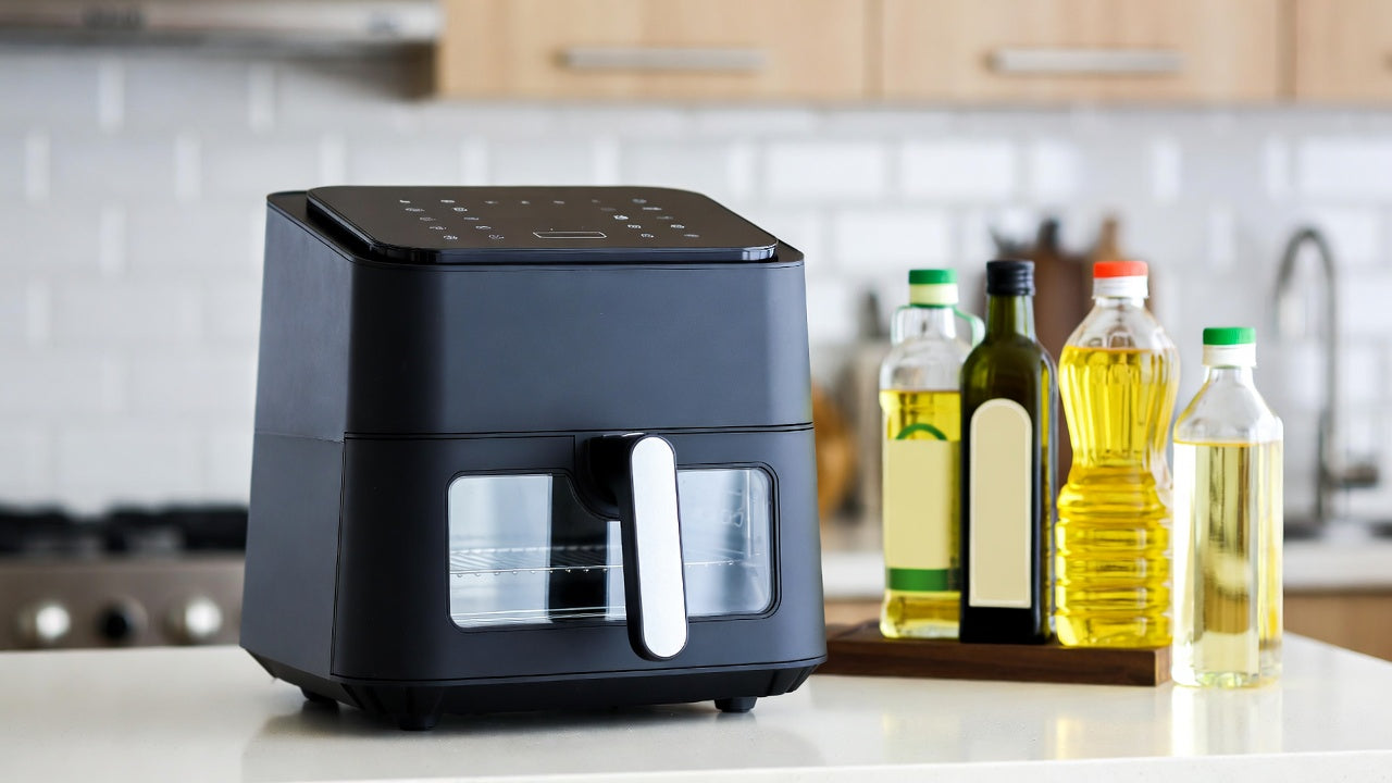 air fryer in a modern kitchen with different cooking oils