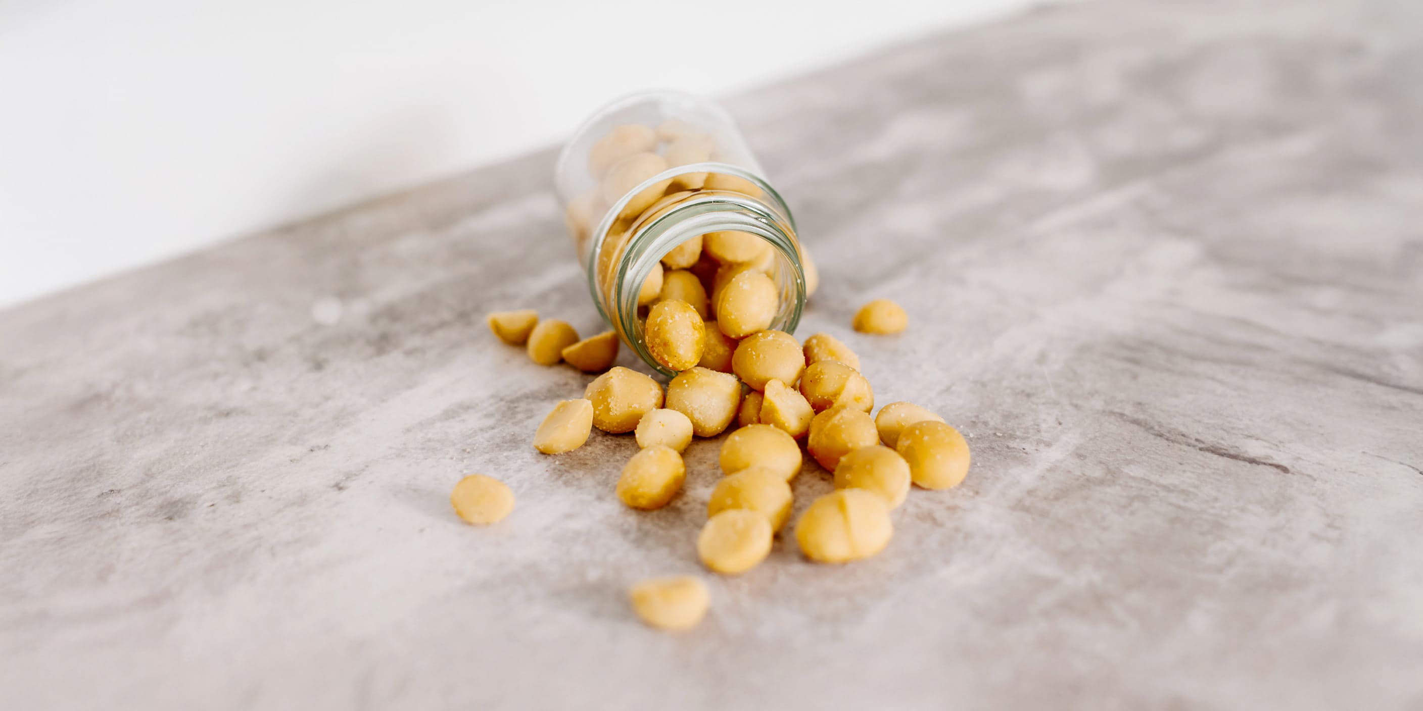 macadamia nuts in glass jar the best nut for fat loss