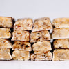 Coconut white chocolate, chocolate, blueberry white chocolate & cocnut white chocolate macadamia snack bar by House of Macadamias, made with macadamias as the first ingredient. Plant based, no seed oils, 100% natural healthy snack bar rich in antioxidants and healthy fats.
