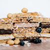 Coconut white chocolate, chocolate, blueberry white chocolate & cocnut white chocolate macadamia snack bar by House of Macadamias, made with macadamias as the first ingredient. Plant based, no seed oils, 100% natural healthy snack bar rich in antioxidants and healthy fats.