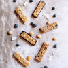 Coconut white chocolate, chocolate, blueberry white chocolate & cocnut white chocolate macadamia snack bar by House of Macadamias, made with macadamias as the first ingredient. Plant based, no seed oils, 100% natural healthy snack bar rich in antioxidants and healthy fats.