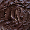 Chocolate Macadamia Nut Butter extreme close-up showing creamy texture, rich in healthy monounsaturated fats and natural ingredients